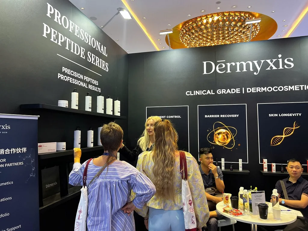 Visitors at Dērmyxis booth, IMCAS China 2026